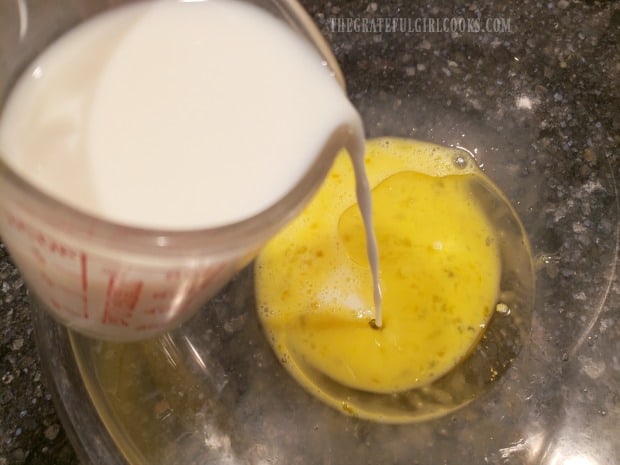 Milk is added to beaten eggs and oil in large bowl.