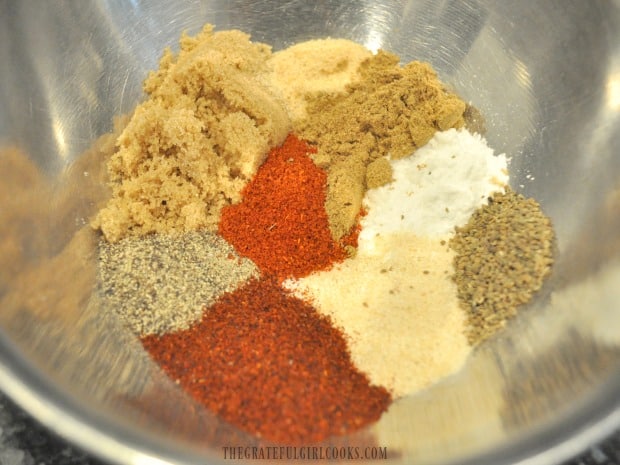 Spices are measured into a small bowl for the chicken wings.