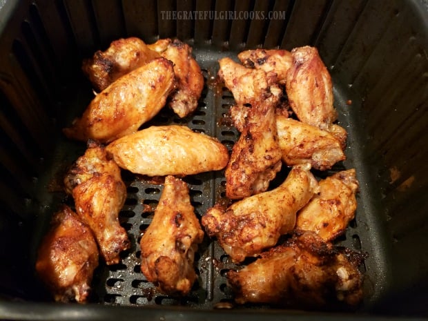 Air Fryer Buffalo Honey Wings in the basket halfway though the cooking time.