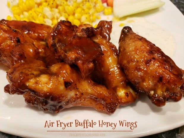 Delicious Air Fryer Buffalo Honey Wings are seasoned with a spice rub, cooked until crisp, and coated with a sweet, spicy sauce to serve.