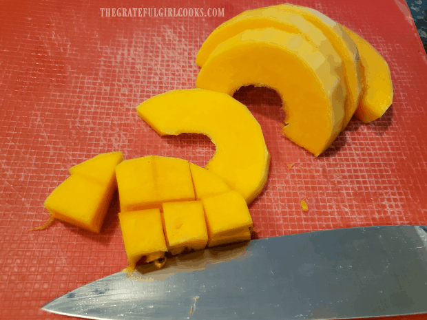 Crescent-shaped slices of the butternut squash are then cut into cubes.