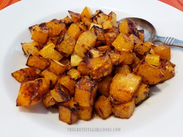 Air fryer glazed butternut squash, served in white bowl.