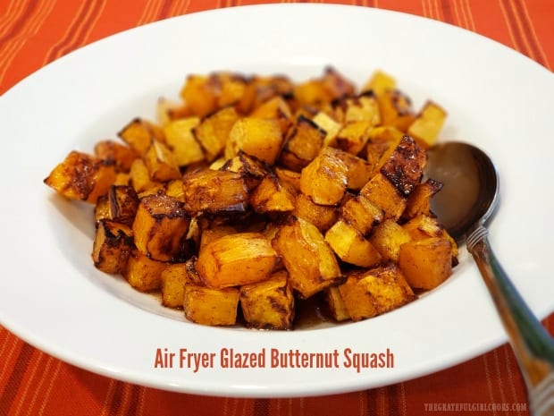 Air Fryer Glazed Butternut Squash is an easy veggie dish, with air fried squash cubes covered in a butter, maple syrup and cinnamon glaze.