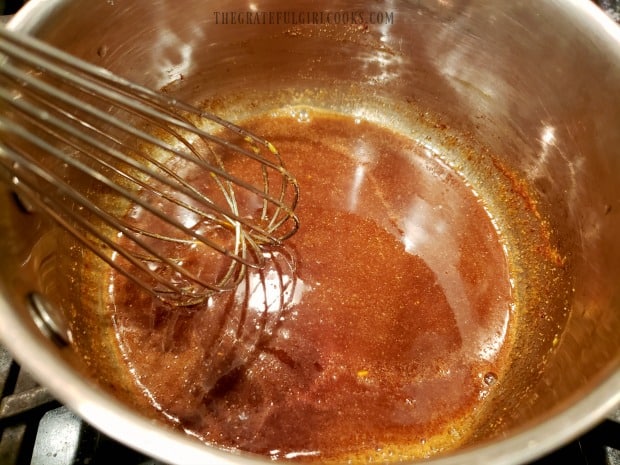 The brown sugar glaze is cooked for 1-2 minutes until it thickens slightly.