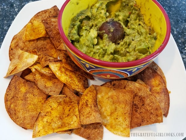 A plate of air fried chili-lime tortilla chips, served with guacamole.