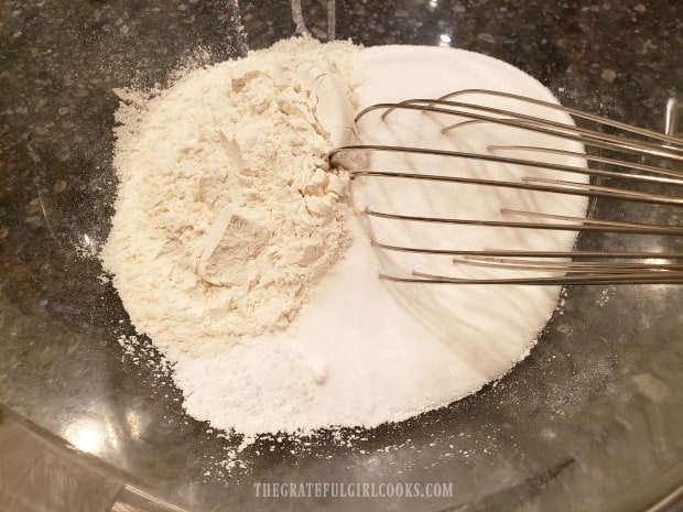 The dry ingredients are whisked together in a large bowl until combined.