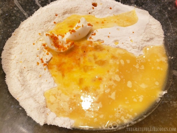 Egg, orange juice, orange zest and shortening are added to dry ingredients.
