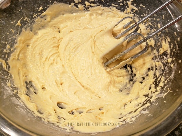 Wet and dry ingredients are mixed together to form batter for the bread.
