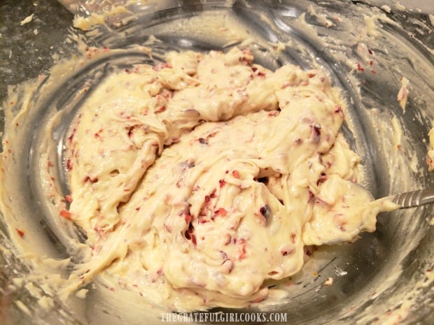 After stirring, the cranberry orange bread batter is ready for a baking pan.