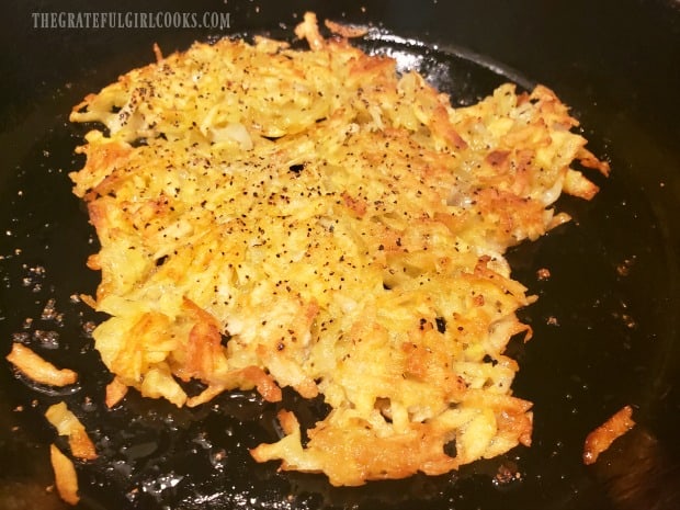 Seasoned crispy hash browns are fully cooked and ready to serve.