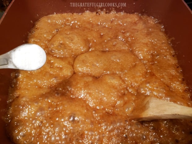 Baking soda is added to the finished caramel sauce.