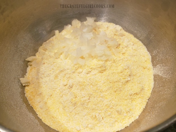 Dry ingredients are sifted into bowl, and minced onion is added.