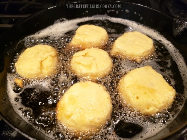Mom's southern hush puppies are cooked in hot oil in a large skillet.