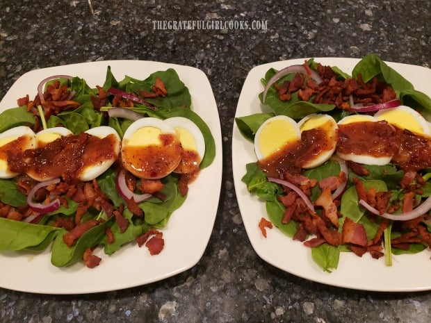 Warm bacon dressing tops each plate full of Bacon Lover's Spinach Salad.