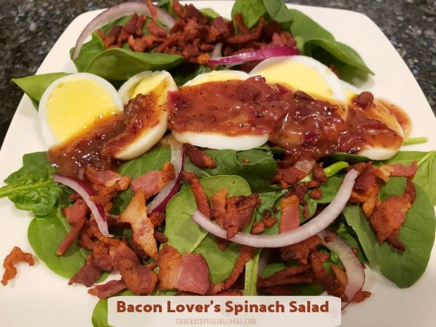 Enjoy Bacon Lover's Spinach Salad for two! Baby spinach leaves topped with hard-boiled eggs, red onion, crisp bacon, and warm bacon dressing!