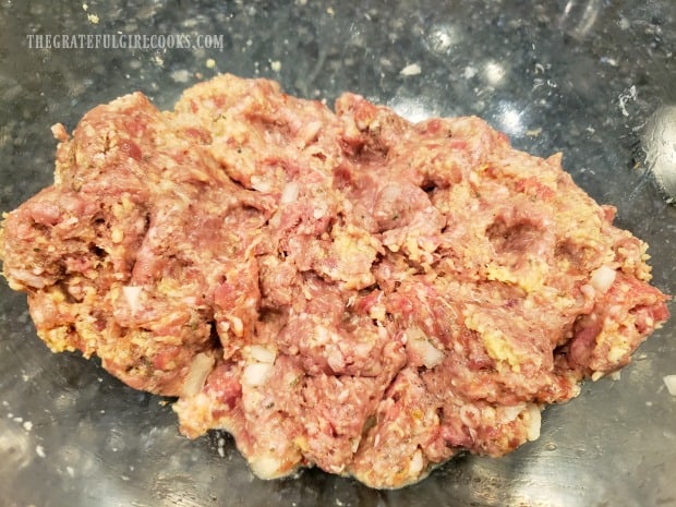 Once combined, the meatloaf mixture will be divided in half.
