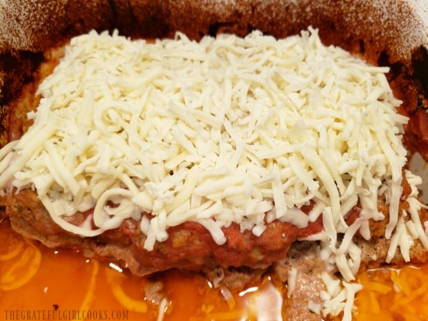 After baking, meatloaf is covered with mozzarella cheese and baked 10 more minutes.