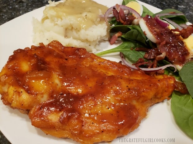 The easy baked bbq chicken, served with mashed potatoes and spinach salad.