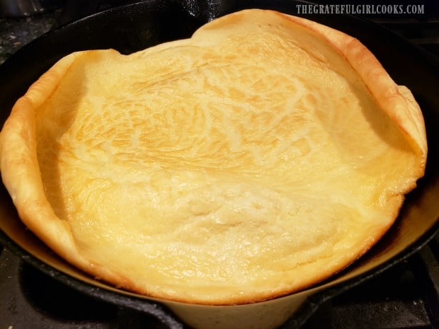 The Lemon Dutch Baby is puffy and golden, once it has been removed from the oven.