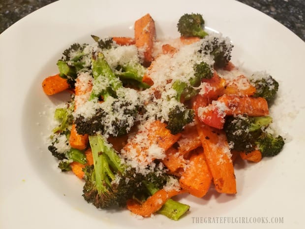 Roasted Italian Veggie Medley is served, topped with finely grated Parmesan cheese.