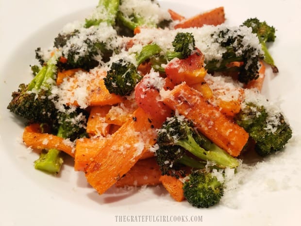 Grated Parmesan cheese garnishes the top of the roasted Italian veggie medley.