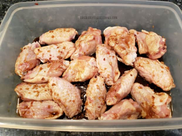 Chicken wings are covered with the marinade, then refrigerated for 4-6 hours.