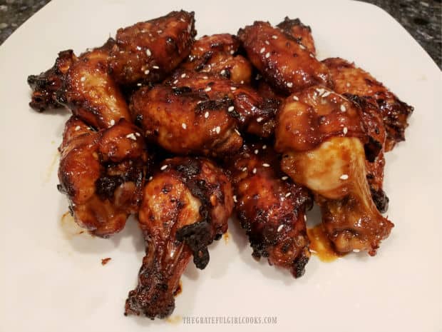 Sprinkled with sesame seeds, the Asian BBQ chicken wings are ready to eat.