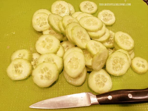 Cucumbers are peeled, and cut into thin slices for Asian Cucumber Salad.