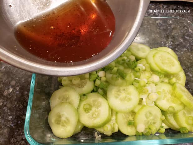 Asian sauce is mixed then poured over cucumber mix to marinate.