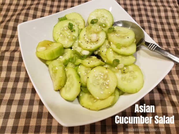 Asian Cucumber Salad is an easy side dish, with sliced cucumbers & green onions marinated in an Asian-inspired sauce, served cold and crispy!