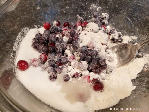 Blueberries and cranberries are mixed with dry ingredients for the fruit crisp.