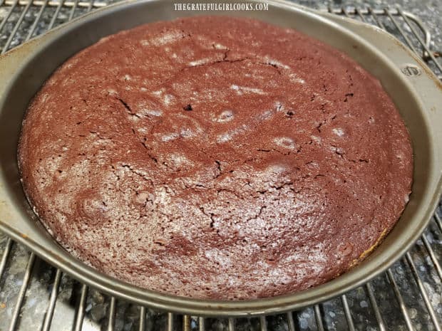 After baking, the cake cools for 5 minutes before inverting onto a platter.