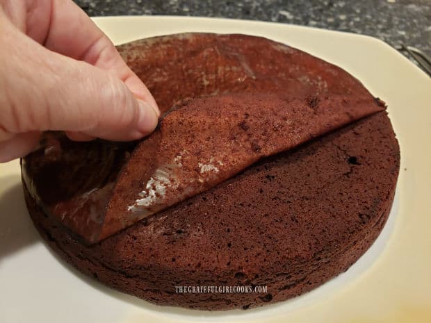 Wax paper is removed from cake after inverting it onto platter.