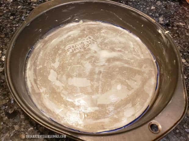 Pan is buttered, and wax paper insert on bottom of pan is buttered.