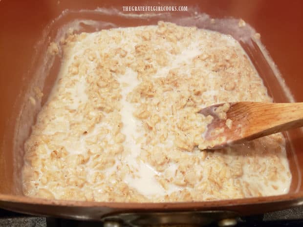 Oatmeal is cooked for 5 minutes, letting milk being absorbed.