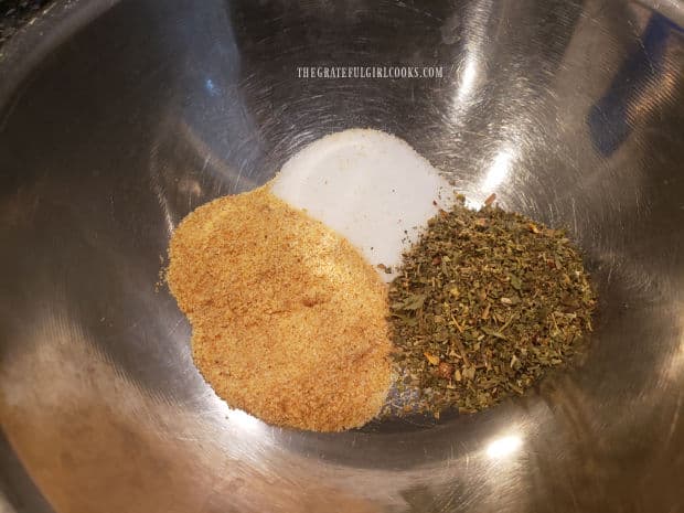 A seasoning mix is made combining Italian seasoning, garlic powder and salt.