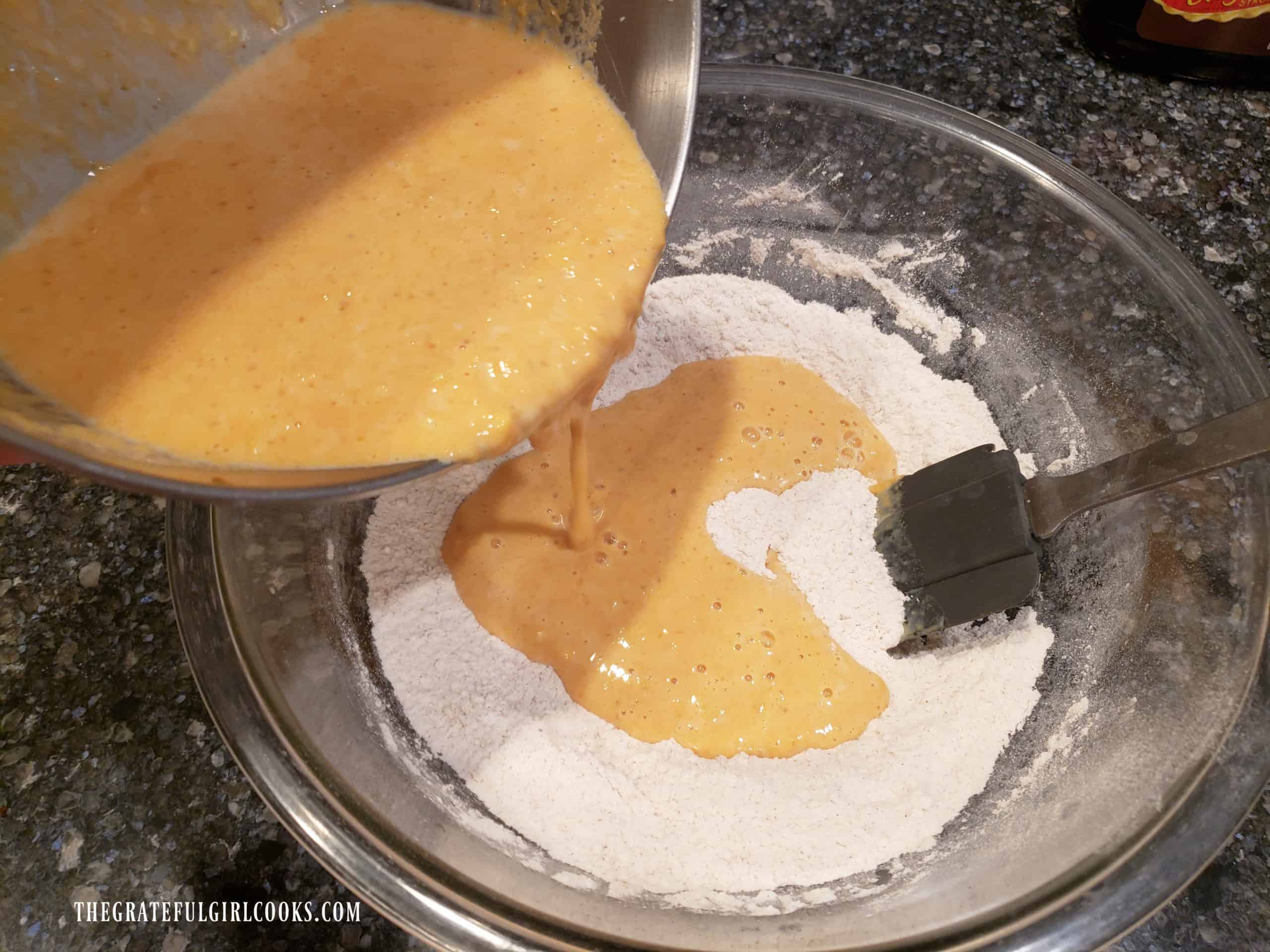 Pumpkin-flavored batter is added to the dry ingredients for the waffles.