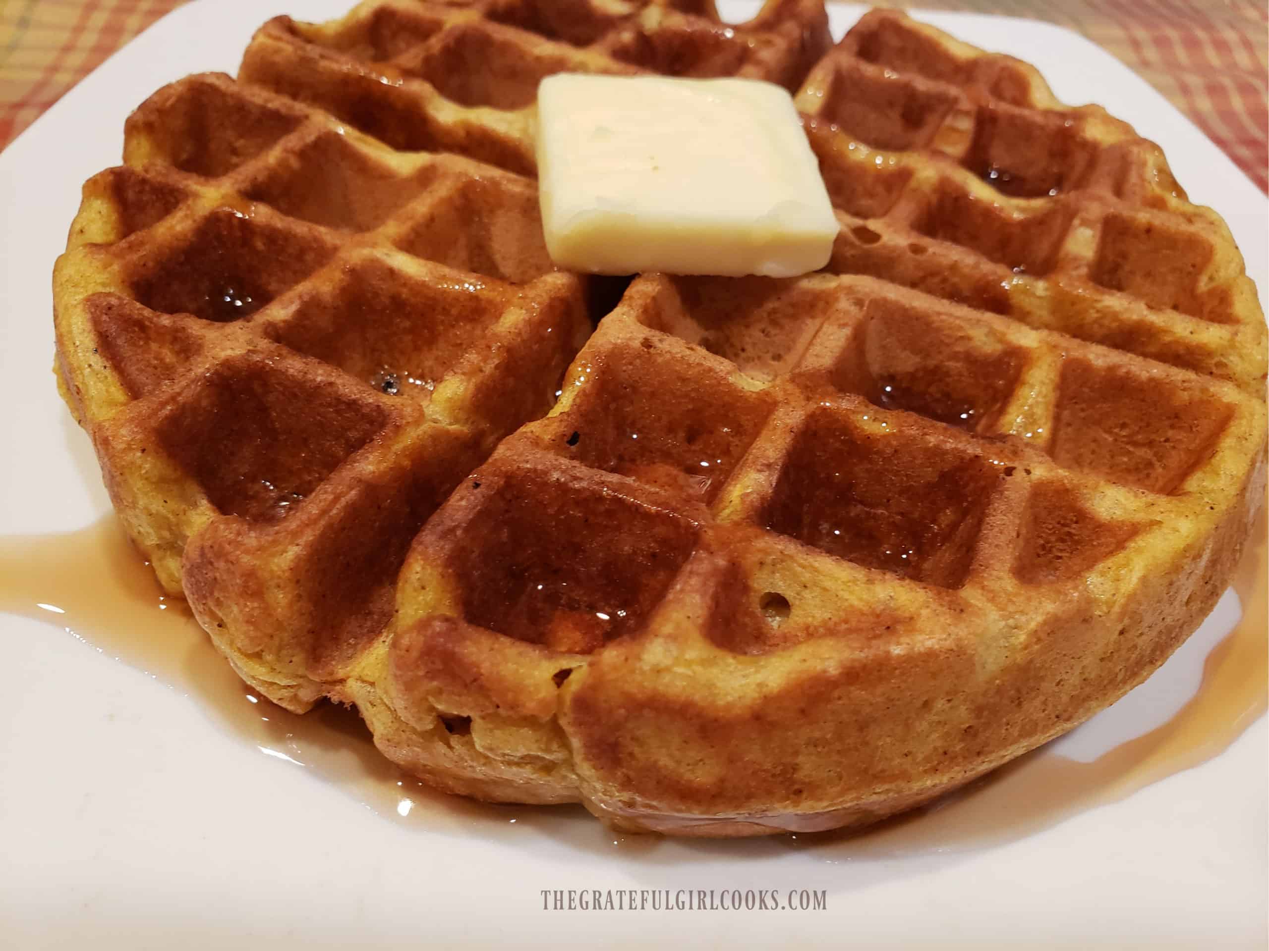 Butter and drizzled maple syrup top off the pumpkin spice waffles.