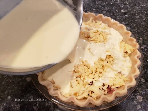 Egg and cream mixture is poured over bacon, onion and cheese in pie shell.