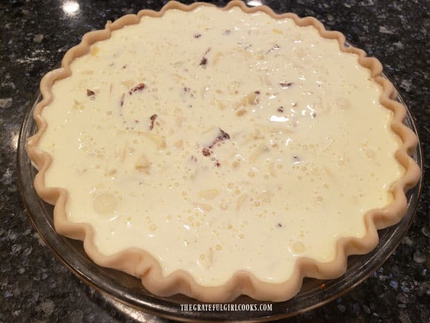 Quiche Lorraine is ready to bake in a hot oven.