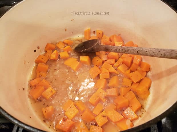 Lightly seasoned butternut squash cubes for the risotto are cooked in water until tender.