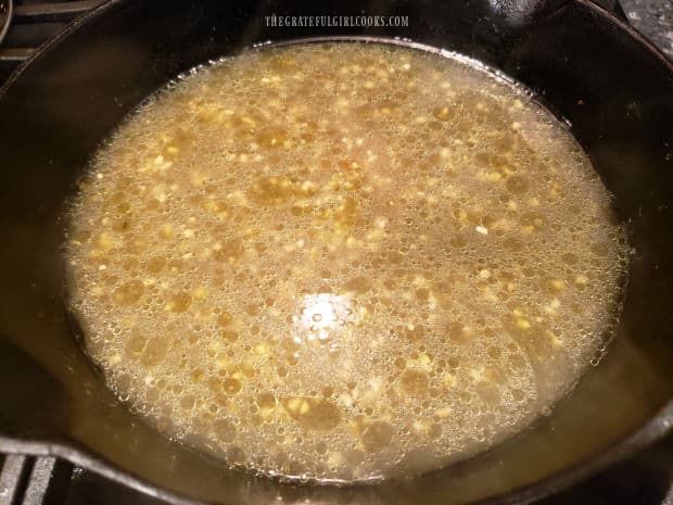 The juices are cooked until liquid reduces to about 1/4 cup in the skillet.