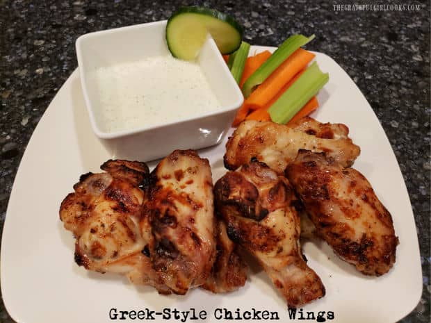 Greek-Style Chicken Wings can be baked or cooked in an air fryer! These marinated wings are served with homemade tzatziki sauce for dipping.