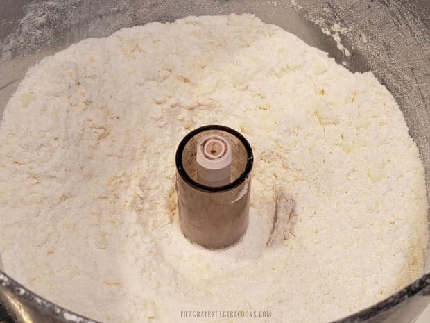 Butter, flour and powdered sugar are processed until tiny crumbs form for crust.