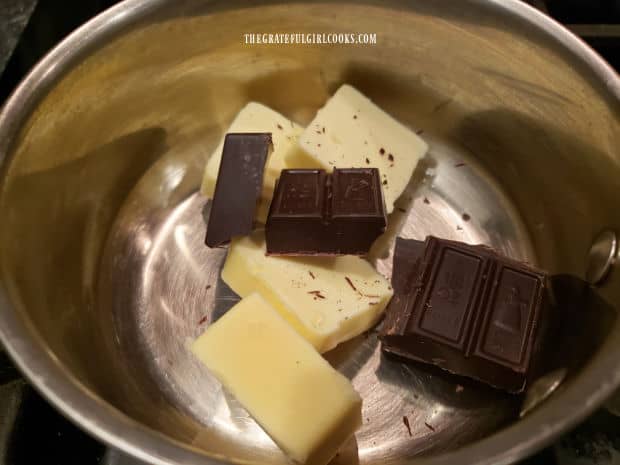 Unsweetened chocolate and butter are melted in a saucepan.