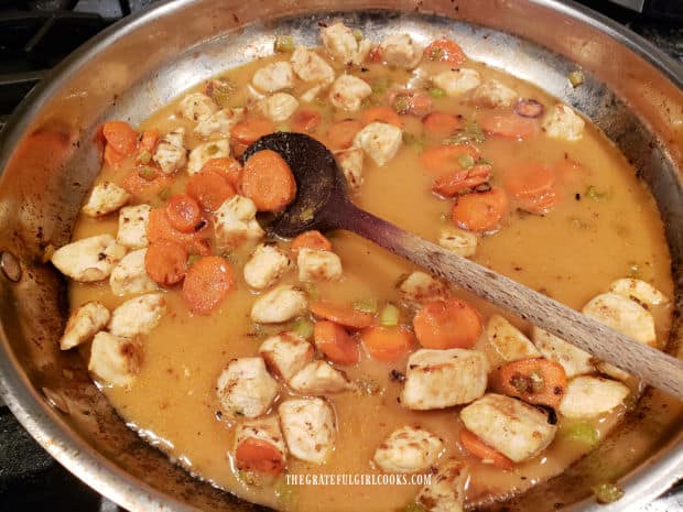 The sauce is added to the orange cashew chicken and cooked for 2 minutes.