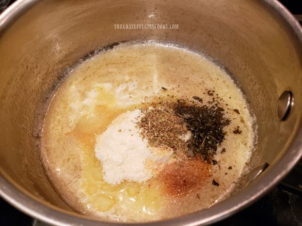 Melted butter, Parmesan cheese and Italian spices in saucepan.