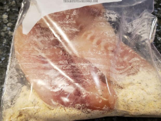 Rockfish fillets are combined with the spice mix in a re-sealable bag.