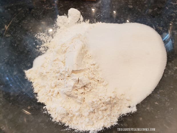 Flour, sugar, baking powder and salt are combined in a large bowl.