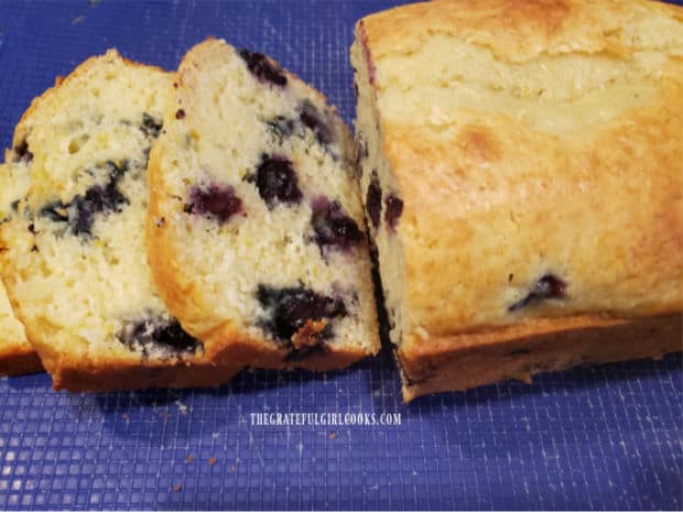 Slices of the blueberry breakfast loaf reveal the juicy blueberries inside.